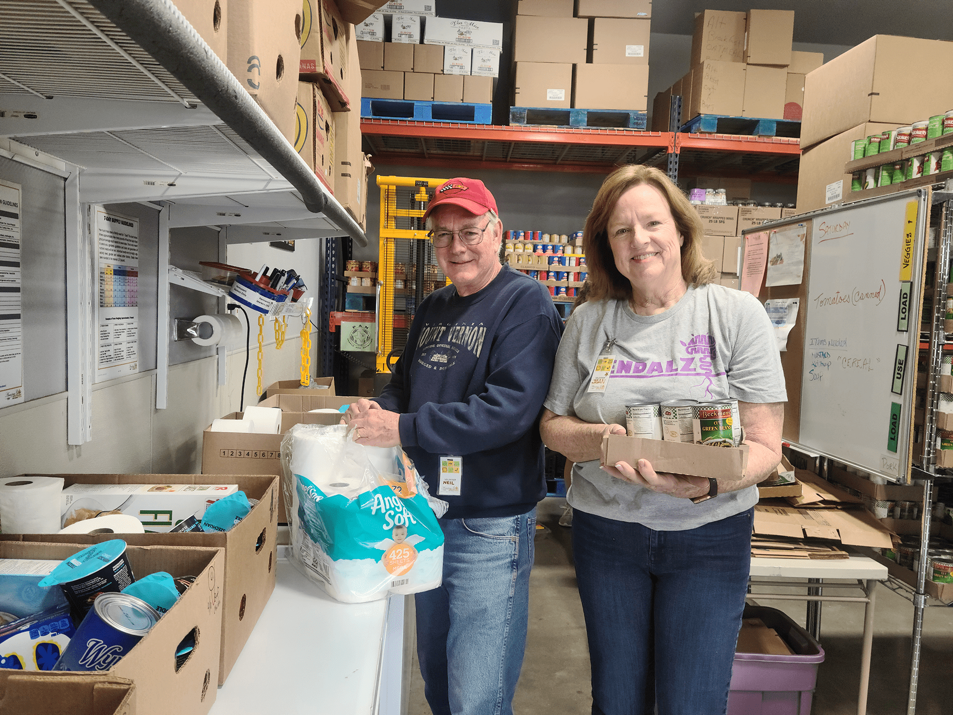 Neil and Joan volunteer at Amazing Grace Food Pantry